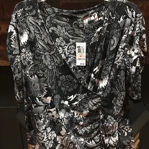 Polyester & spandex pullover blouse.